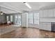 A kitchen that opens up to a living space with a sliding glass door at 10327 Shelter Rock Ct, Charlotte, NC 28214