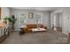 Comfortable living room featuring a plush sofa, neutral carpet, and an abundance of natural light at 10327 Shelter Rock Ct, Charlotte, NC 28214