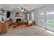 Inviting living room with a fireplace, ceiling fan, and access to the outdoors at 10327 Shelter Rock Ct, Charlotte, NC 28214