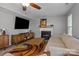 A living room with a fireplace, television, and comfortable seating at 10327 Shelter Rock Ct, Charlotte, NC 28214
