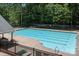 Large community pool with clearly marked lanes and ample deck space for residents at 10327 Shelter Rock Ct, Charlotte, NC 28214