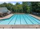 Spacious community swimming pool with a separate shallow end and lounge area at 10327 Shelter Rock Ct, Charlotte, NC 28214