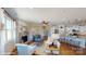 Bright and airy living room with fireplace, open to the kitchen with a breakfast bar at 106 Noah Ln, Troutman, NC 28166