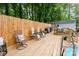 Backyard deck and outdoor seating area with privacy fencing at 107 Oakland Rd, Belmont, NC 28012