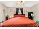 Comfortable bedroom with hardwood floors, ceiling fan, warm lighting, and modern decor at 107 Oakland Rd, Belmont, NC 28012