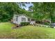 Charming single Gathering home with a cozy front porch and lush green yard at 107 Oakland Rd, Belmont, NC 28012