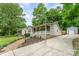 Charming single Gathering home with a beautiful front yard, long driveway and detached garage at 107 Oakland Rd, Belmont, NC 28012