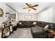 Spacious living room with a view into the kitchen, featuring comfortable seating and vintage decor at 107 Oakland Rd, Belmont, NC 28012