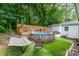 Backyard pool area with deck and mature trees at 107 Oakland Rd, Belmont, NC 28012