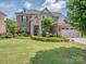 Charming two-story home with stone accents, manicured lawn, and attached two-car garage at 114 Reserve Ln, Fort Mill, SC 29707