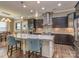 Modern kitchen with stainless steel appliances, granite countertops, and spacious island at 114 Reserve Ln, Fort Mill, SC 29707