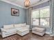 Cozy living room with neutral tones, a white sofa, and a large window for ample sunlight at 114 Reserve Ln, Fort Mill, SC 29707