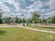 Community playground and recreation area with grassy space and walking trails at 114 Reserve Ln, Fort Mill, SC 29707