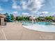 Community pool with a mushroom water feature, slide, and plenty of lounge seating at 114 Reserve Ln, Fort Mill, SC 29707