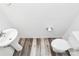 Half bathroom featuring a pedestal sink, toilet and modern flooring at 1218 Rosada Dr, Charlotte, NC 28213