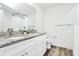 Modern bathroom featuring double vanity with granite countertops and brushed metal fixtures at 1218 Rosada Dr, Charlotte, NC 28213