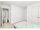 Comfortable bedroom featuring a closet and an entrance to a connected bathroom, offering convenience and functionality at 1218 Rosada Dr, Charlotte, NC 28213