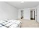 Spacious bedroom with connecting entrances and plush carpeting, offering versatility and comfortable living at 1218 Rosada Dr, Charlotte, NC 28213