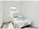 Comfortable bedroom with a patterned comforter, great natural light, and neutral walls at 1218 Rosada Dr, Charlotte, NC 28213