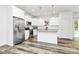 Modern kitchen with stainless steel appliances, granite countertops, island, and ample cabinet space at 1218 Rosada Dr, Charlotte, NC 28213