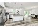 Modern kitchen with stainless steel appliances, granite countertops, island, and open to the dining room at 1218 Rosada Dr, Charlotte, NC 28213