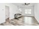 Bright living room featuring neutral walls, modern flooring and access to a half bathroom at 1218 Rosada Dr, Charlotte, NC 28213