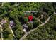 Aerial view of the home nestled among lush greenery at 122 Sleepy Cove Trl, Mooresville, NC 28117