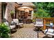Cozy outdoor deck with stylish furniture and a shaded seating area, perfect for relaxation and entertaining at 122 Sleepy Cove Trl, Mooresville, NC 28117