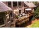 Multi-level brick home featuring an outdoor deck with ample seating, perfect for entertaining guests at 122 Sleepy Cove Trl, Mooresville, NC 28117