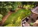 A well-maintained backyard with a spacious deck offering outdoor seating and a serene view at 122 Sleepy Cove Trl, Mooresville, NC 28117