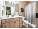 Bright bathroom with a large mirror, decorative plant, and neutral fixtures at 122 Sleepy Cove Trl, Mooresville, NC 28117