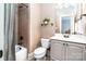 Neutral bathroom with combined shower and tub, tiled floor, and a white vanity at 122 Sleepy Cove Trl, Mooresville, NC 28117
