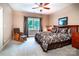 Relaxing bedroom with a large window, comfortable bed, and a cozy chair at 122 Sleepy Cove Trl, Mooresville, NC 28117
