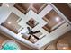Close-up of a unique coffered ceiling with recessed lighting and a modern ceiling fan design at 122 Sleepy Cove Trl, Mooresville, NC 28117