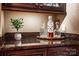 Decorative bottles sit atop a dark granite countertop with dark wood cabinetry at 122 Sleepy Cove Trl, Mooresville, NC 28117