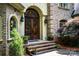 Elegant home featuring a detailed front door and brick facade at 122 Sleepy Cove Trl, Mooresville, NC 28117