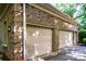 Spacious two-car garage with neutral doors, offering ample parking and storage space at 122 Sleepy Cove Trl, Mooresville, NC 28117