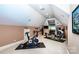 Spacious home gym with multiple exercise machines and a wall-mounted television at 122 Sleepy Cove Trl, Mooresville, NC 28117