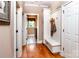 Hallway featuring custom storage and a convenient bench with access to the laundry room at 122 Sleepy Cove Trl, Mooresville, NC 28117