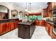 Gourmet kitchen with granite countertops, custom cabinets, and a large center island for meal preparation at 122 Sleepy Cove Trl, Mooresville, NC 28117