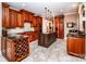 Spacious kitchen features custom wood cabinetry, granite countertops, wine rack, and a center island at 122 Sleepy Cove Trl, Mooresville, NC 28117