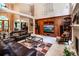 Gathering room featuring built-in shelving, a coffered ceiling, and a fireplace for cozy gatherings at 122 Sleepy Cove Trl, Mooresville, NC 28117