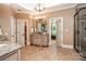 Primary bathroom with double vanity, granite countertops and tile floors at 122 Sleepy Cove Trl, Mooresville, NC 28117