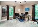 Bright home office with natural light, ceiling fan, neutral colors and built-in shelving at 122 Sleepy Cove Trl, Mooresville, NC 28117