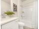 Bright bathroom with white vanity, shower-tub combo, and modern fixtures at 125 Noah Ln, Troutman, NC 28166