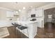 Modern kitchen featuring a large island, stainless steel appliances, and white cabinetry at 125 Noah Ln, Troutman, NC 28166