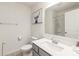 Clean bathroom with a modern sink, toilet, and a shower with a translucent glass door at 13221 Gadwal Pintail Dr, Charlotte, NC 28262