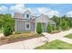 Exterior view of the clubhouse surrounded by landscaping and a sidewalk at 13221 Gadwal Pintail Dr, Charlotte, NC 28262