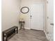 Welcoming entryway with hardwood floors, a bench, and decor at 13221 Gadwal Pintail Dr, Charlotte, NC 28262