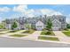 Row of new townhomes with garages and well-maintained landscaping at 13221 Gadwal Pintail Dr, Charlotte, NC 28262